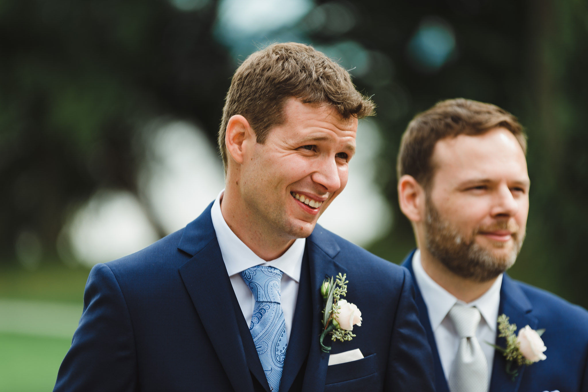 groom smiling as he sees his bride for the first time during their no first look ceremony at La Paletta Mansion in Burlington Ontario