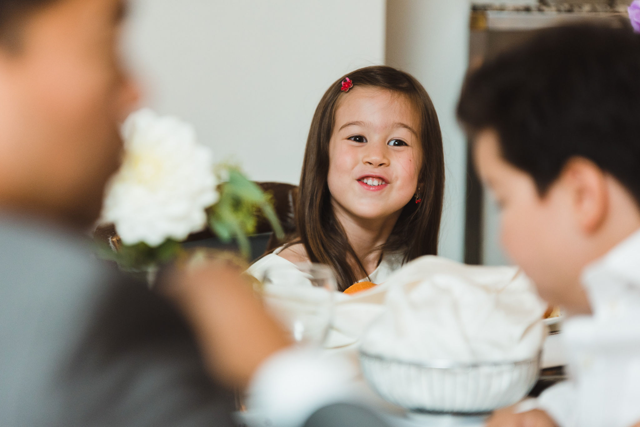 young girl smiling during a Parisian inspired wedding at La Maquette in Toronto Ontario