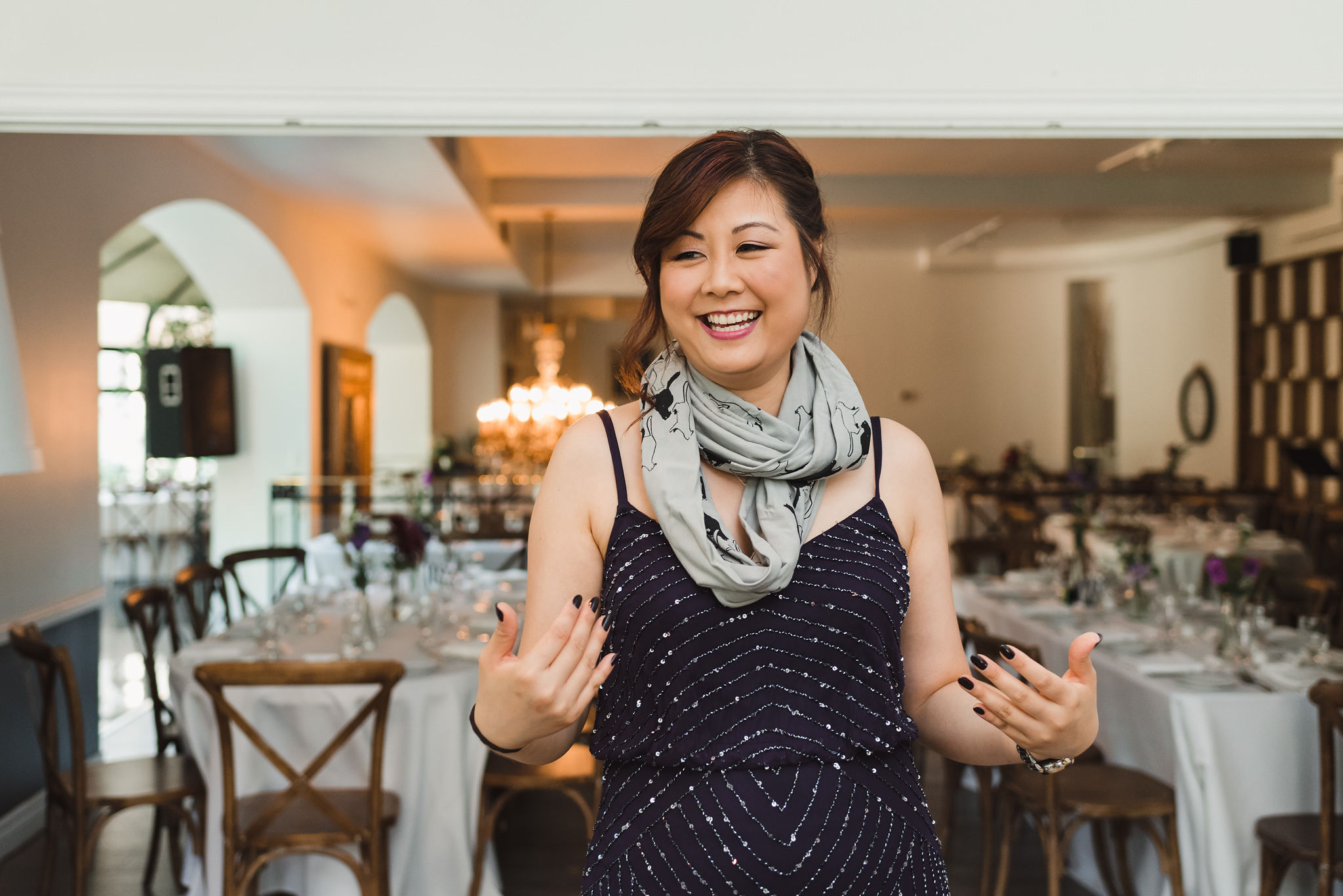 bridesmaid smiling before she gets ready for Parisian inspired wedding at La Maquette in Toronto Ontario