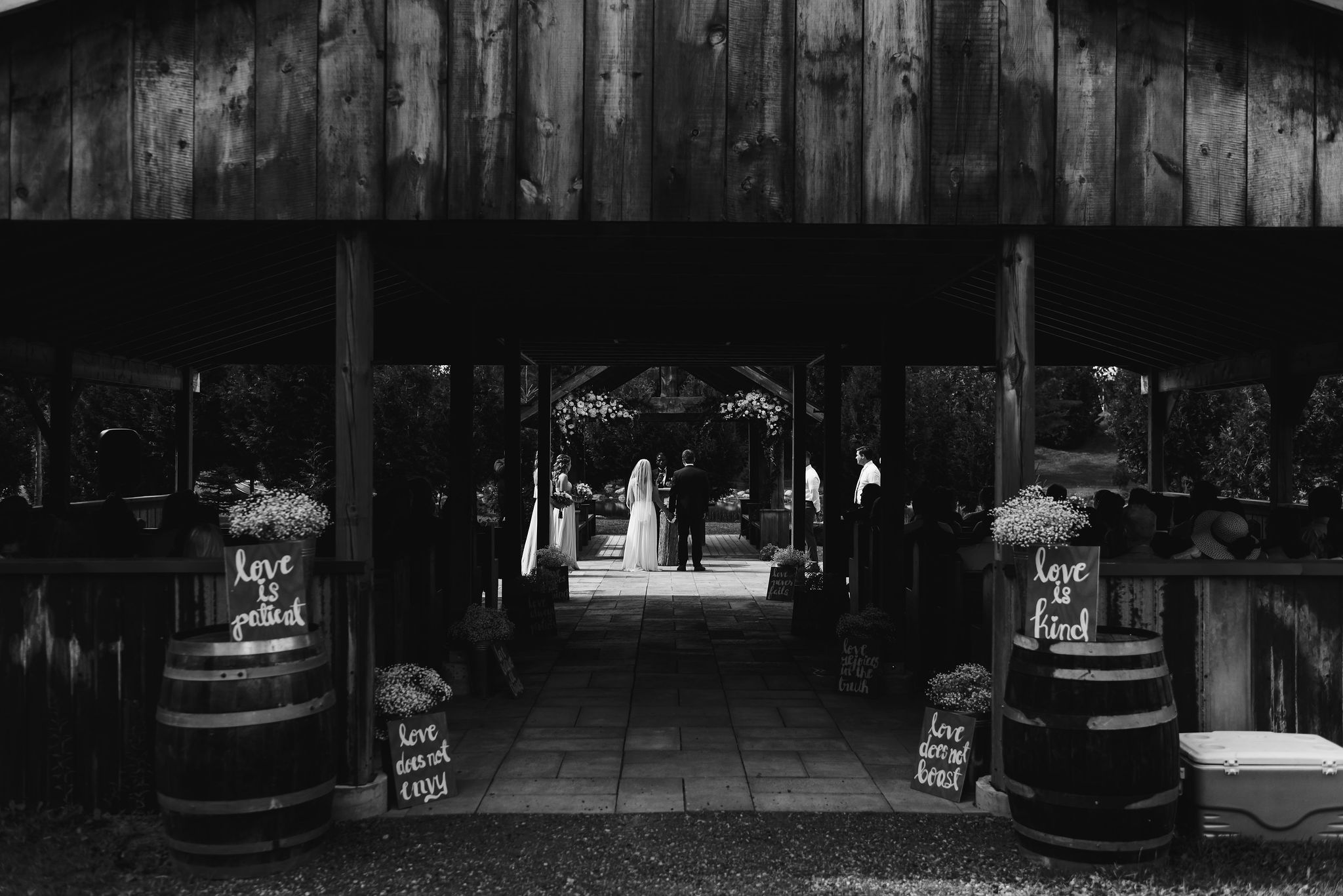bride and groom standing at the alter during their wedding ceremony at Carvers cottage in Toronto