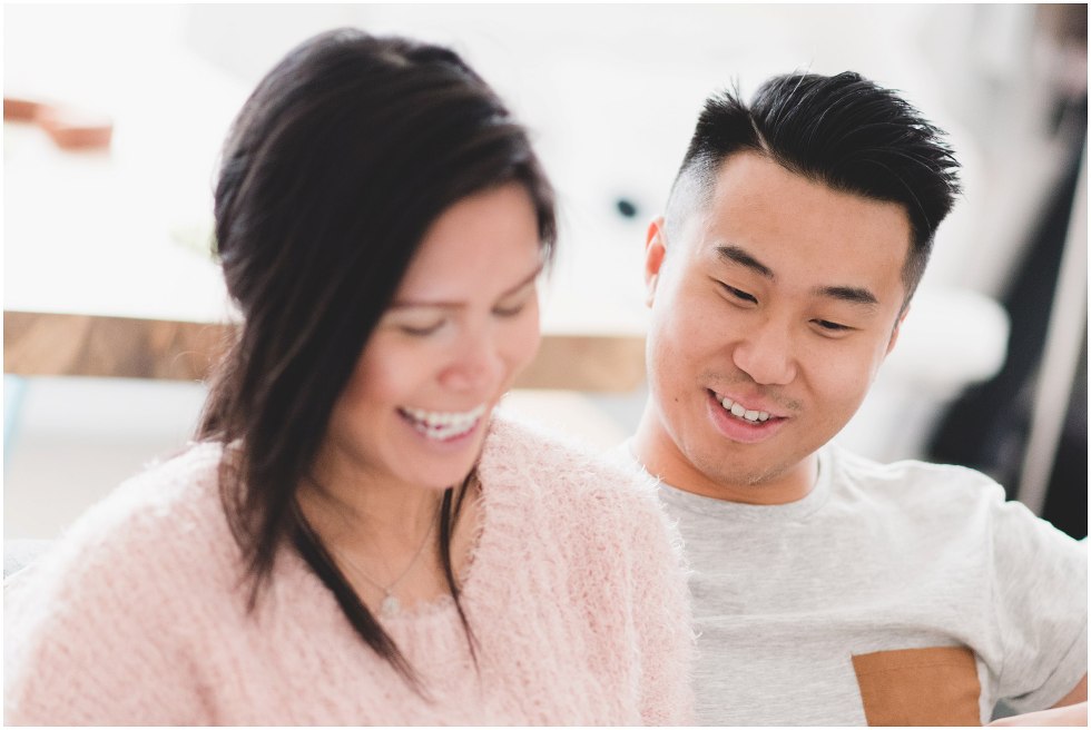 Husband lovingly smiles at wife. 