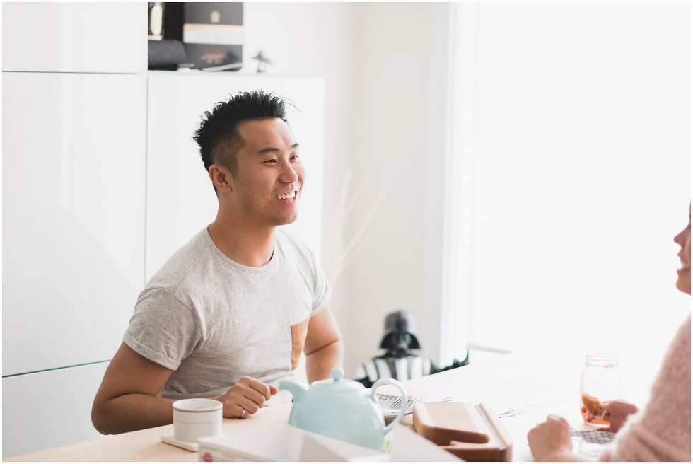 Husband smiling at wife over lunch time. 