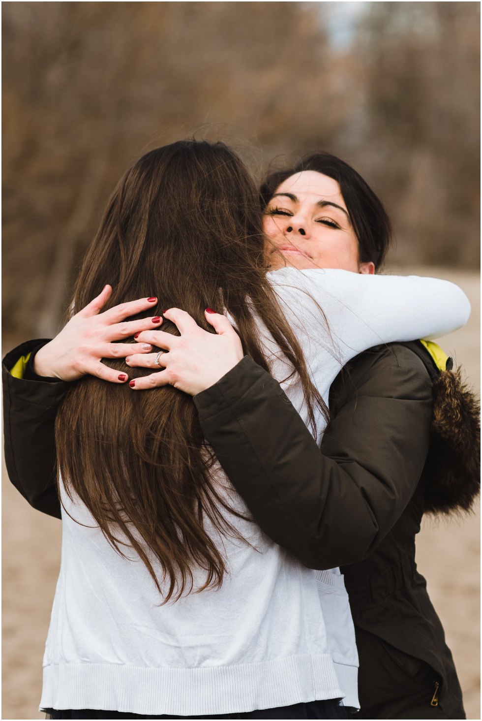 two women hugging Toronto proposal photography