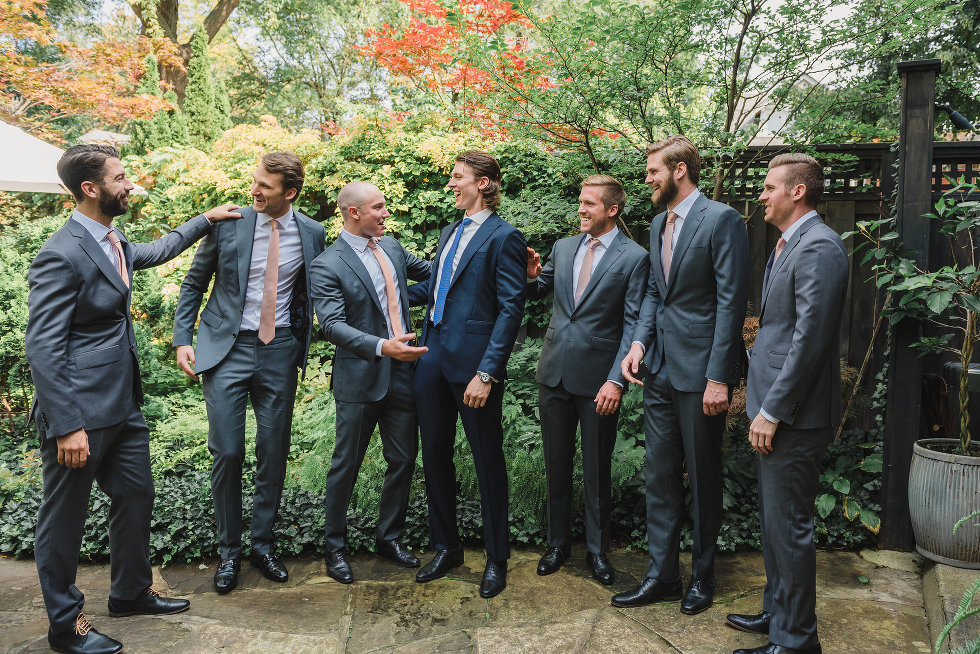 groom and his groomsmen in a garden Toronto wedding photographer