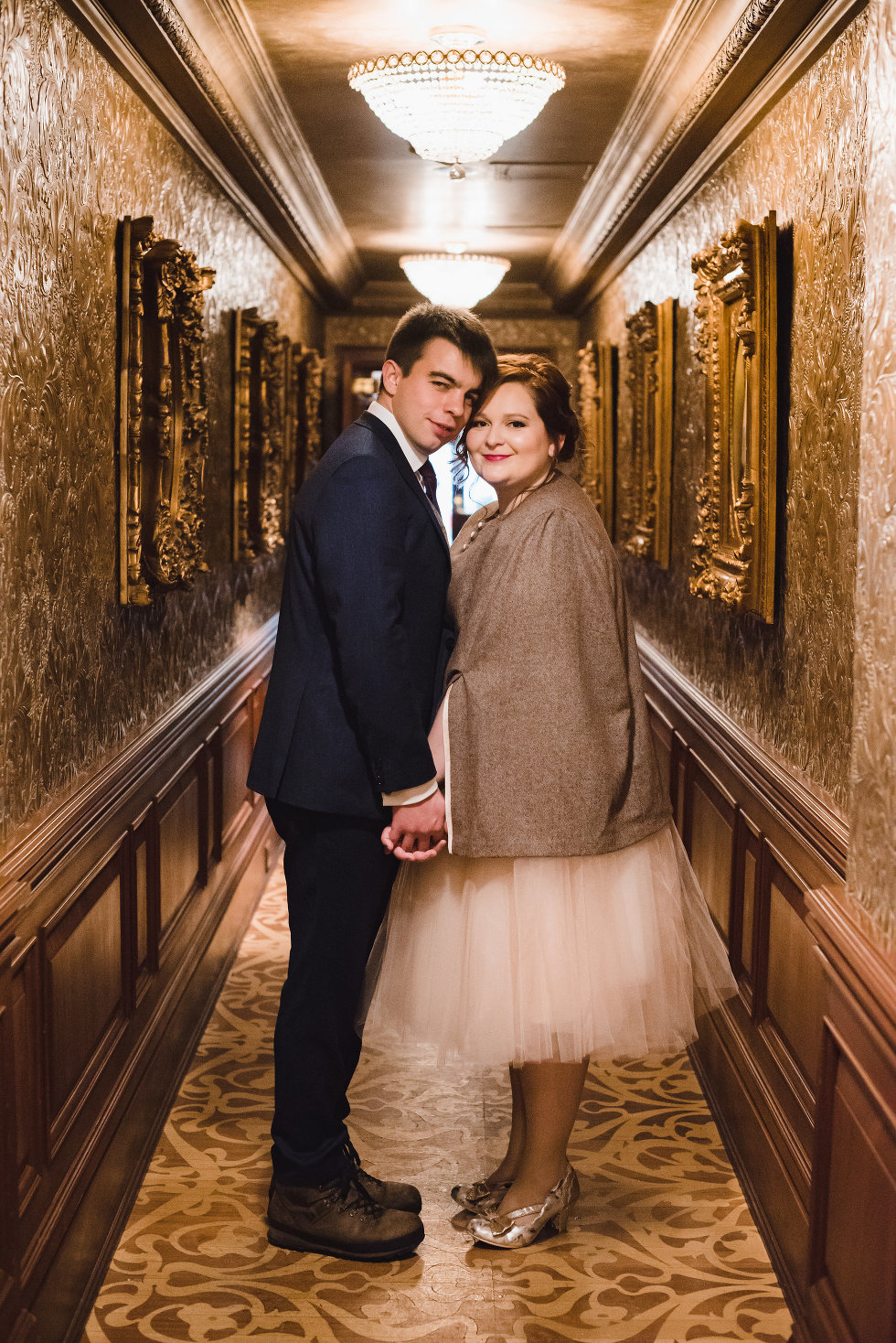 bride and groom embracing each other in Victorian hallway of Prince of Wales Hotel Niagara wedding