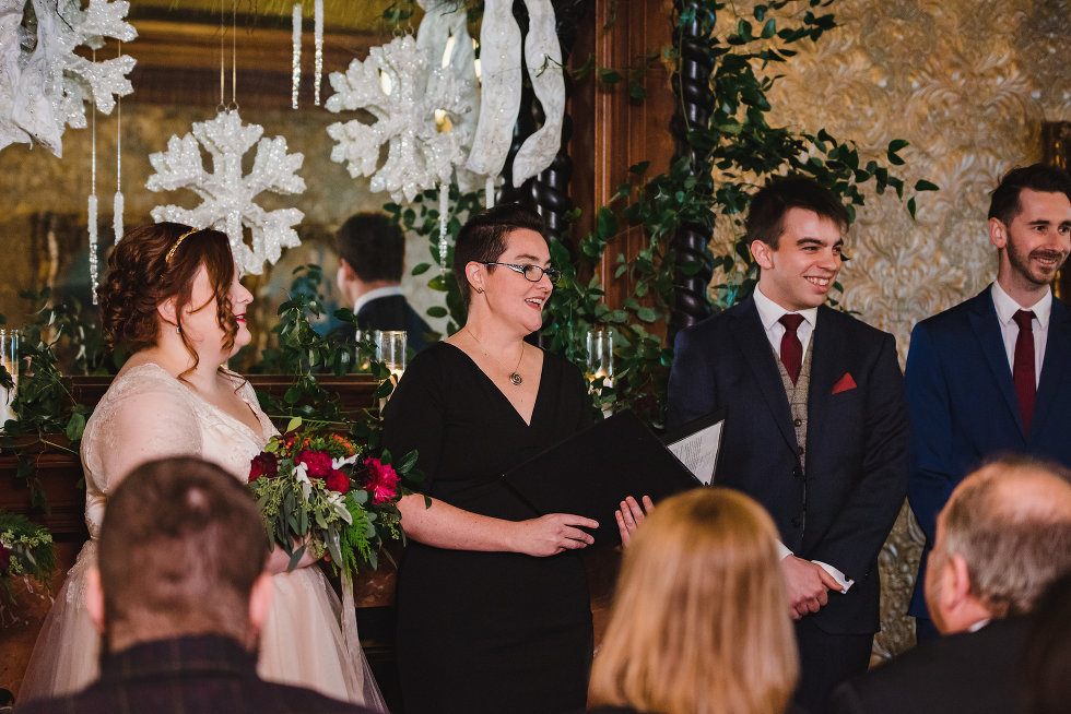 bride and groom having ceremony performed by officiant in the middle Niagara wedding