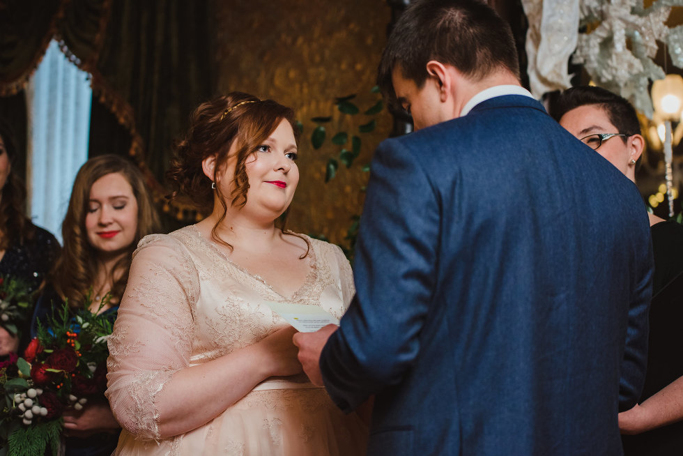 groom holding brides hand during wedding ceremony Toronto wedding photography Gillian Foster 