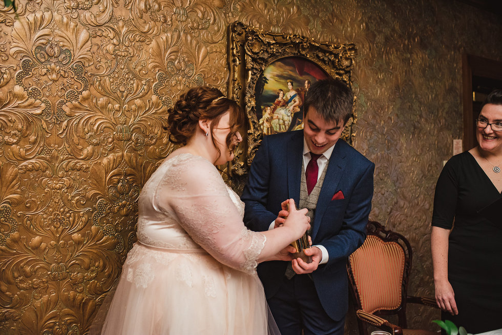 bride and groom both mix cocktail shaker together Prince of Wales Hotel Wedding photography 