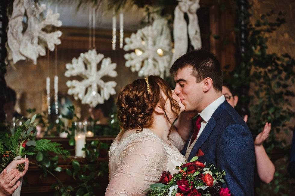 bride and groom seal ceremony with a kiss Prince of Wales Hotel Niagara wedding photography