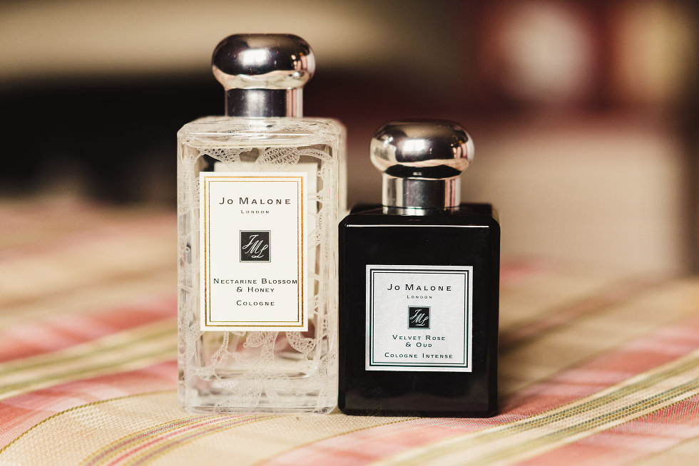 a white bottle and black bottle of Jo Malone colognes Niagara wedding 