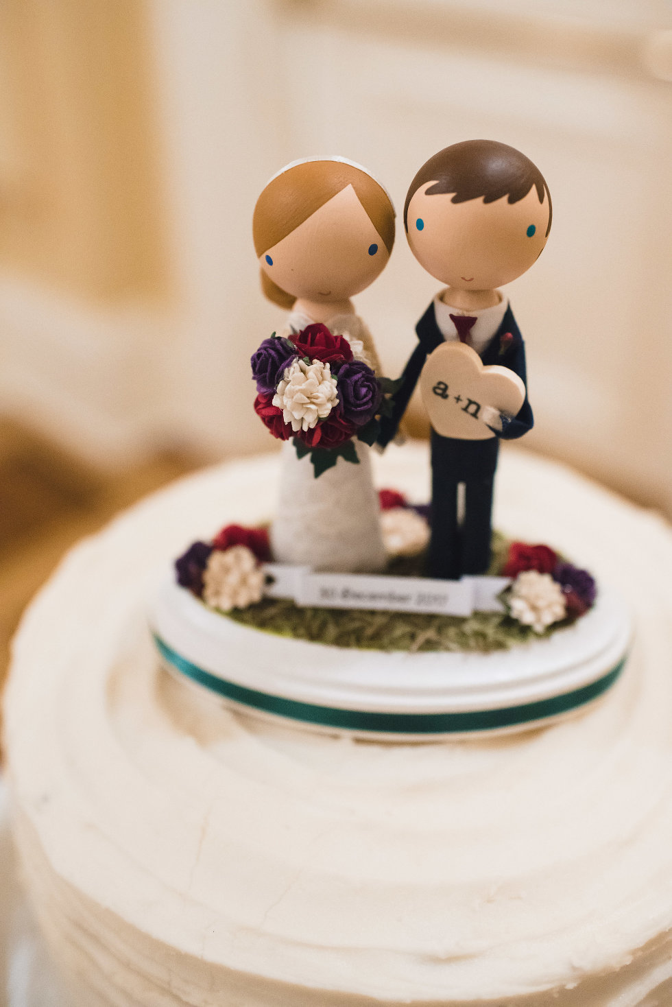 bride and groom topped wedding cake Niagara wedding photography