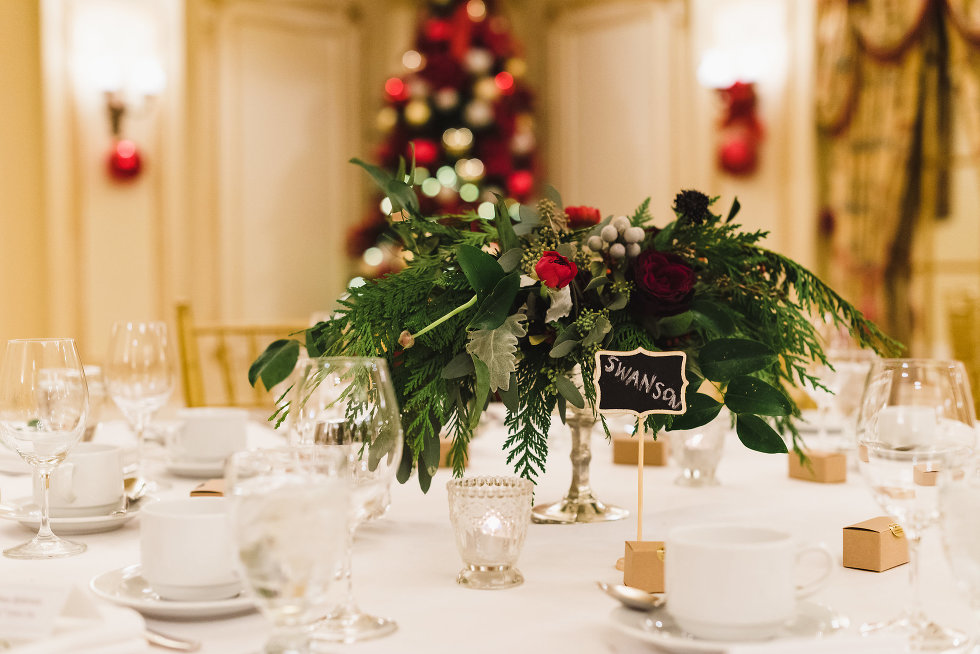 red and green centrepieces on white tabletop Prince of Wales Hotel Niagara wedding photography