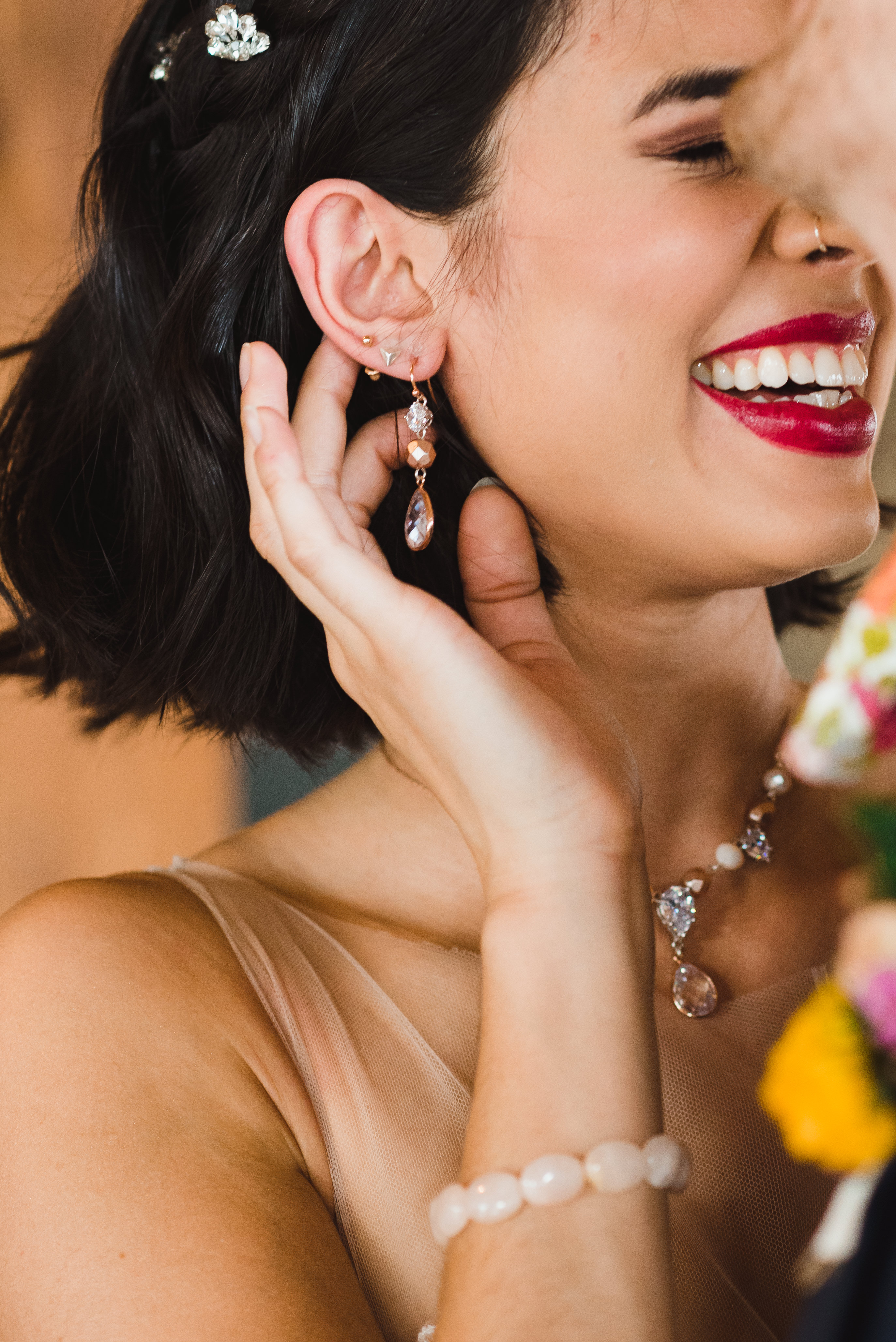 bride laughing and brushing her hair behind her ear with her fingers Jam Factory wedding photography Toronto 