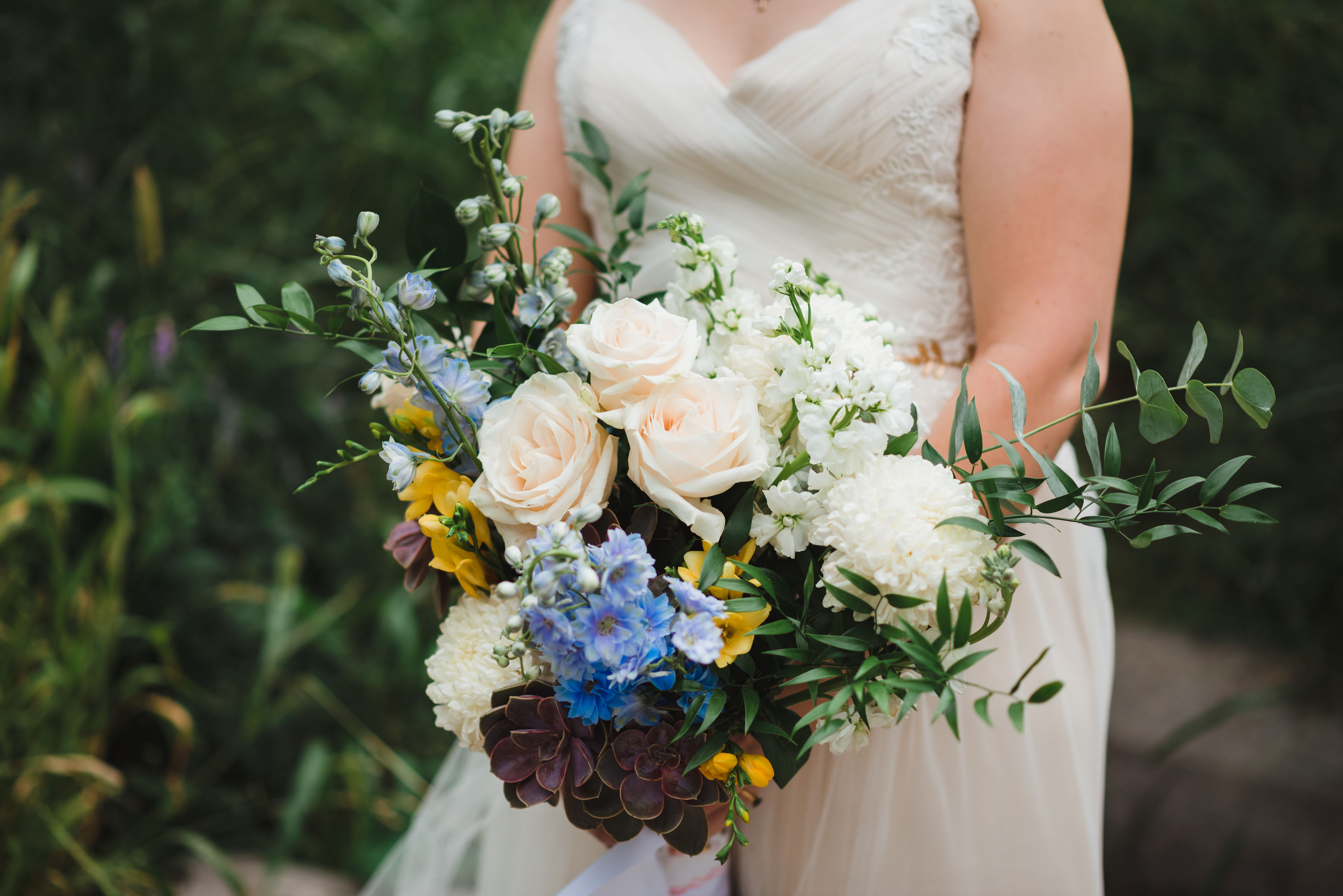 bride in white wedding dress holding her bouquet Toronto brewery wedding photography