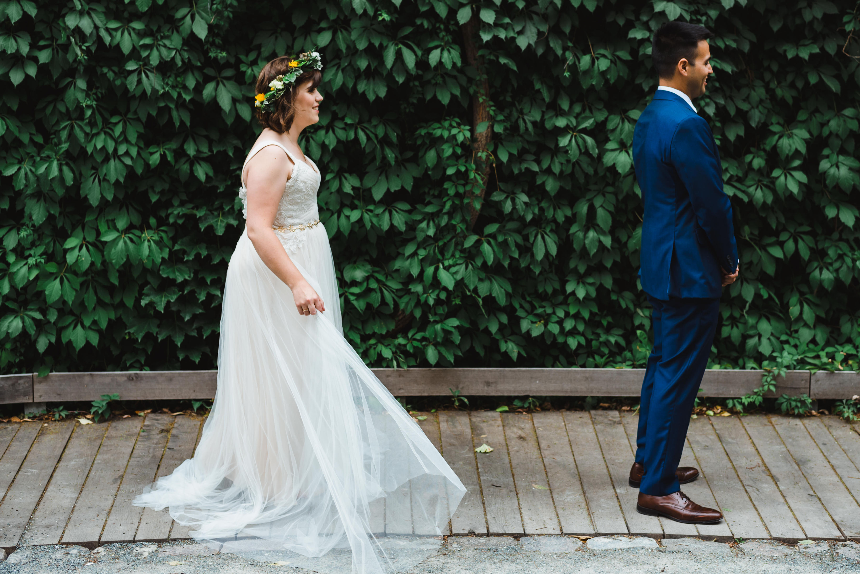 bride approaching groom for their first look Toronto Junction Craft Brewing wedding photography