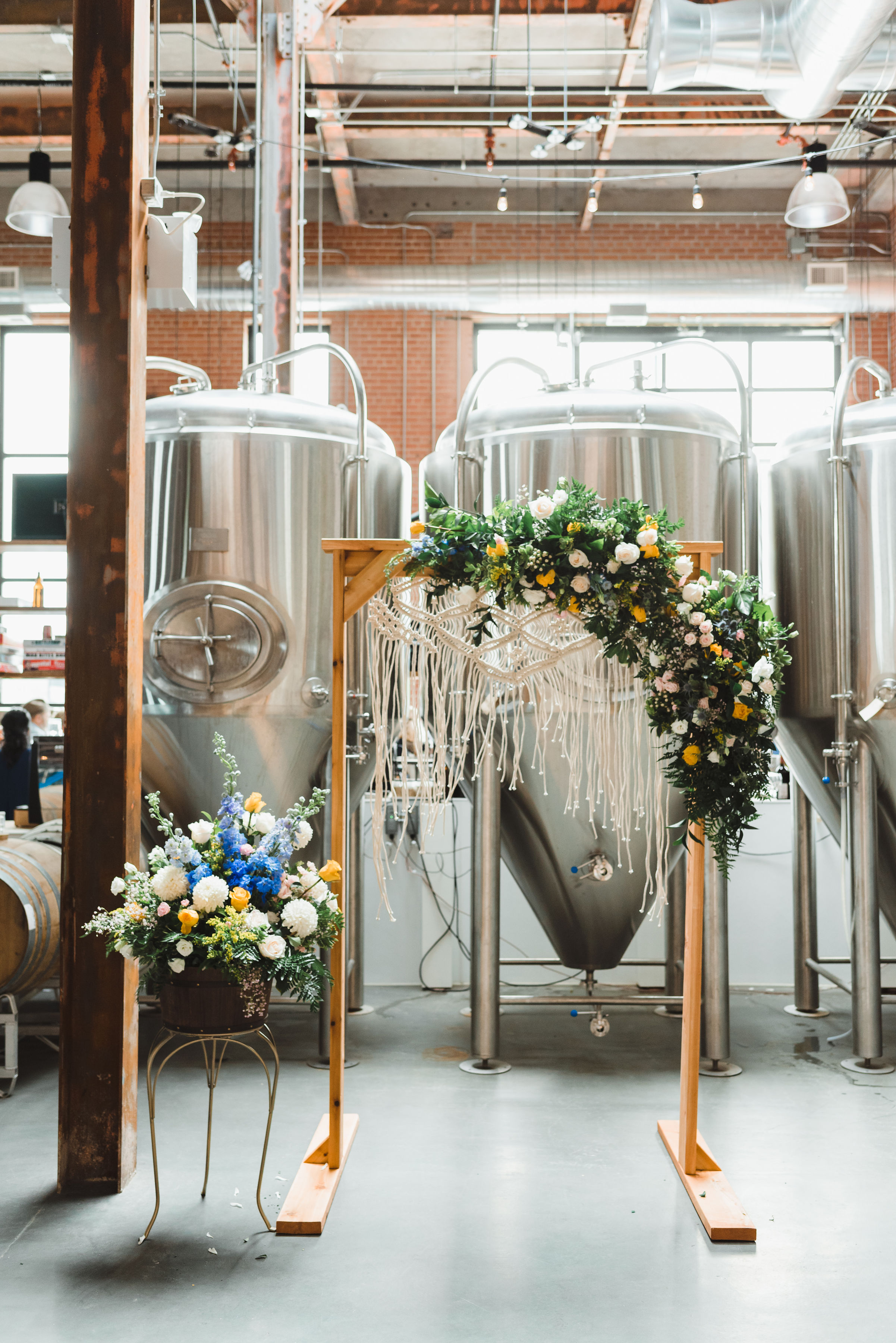 wedding alter set up in front of brewing tanks Toronto Junction Craft Brewing wedding