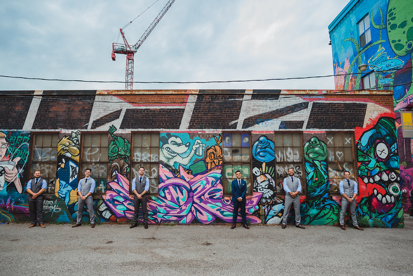 Toronto wedding party capturing photos in Graffiti alley for a Junction Brewery wedding