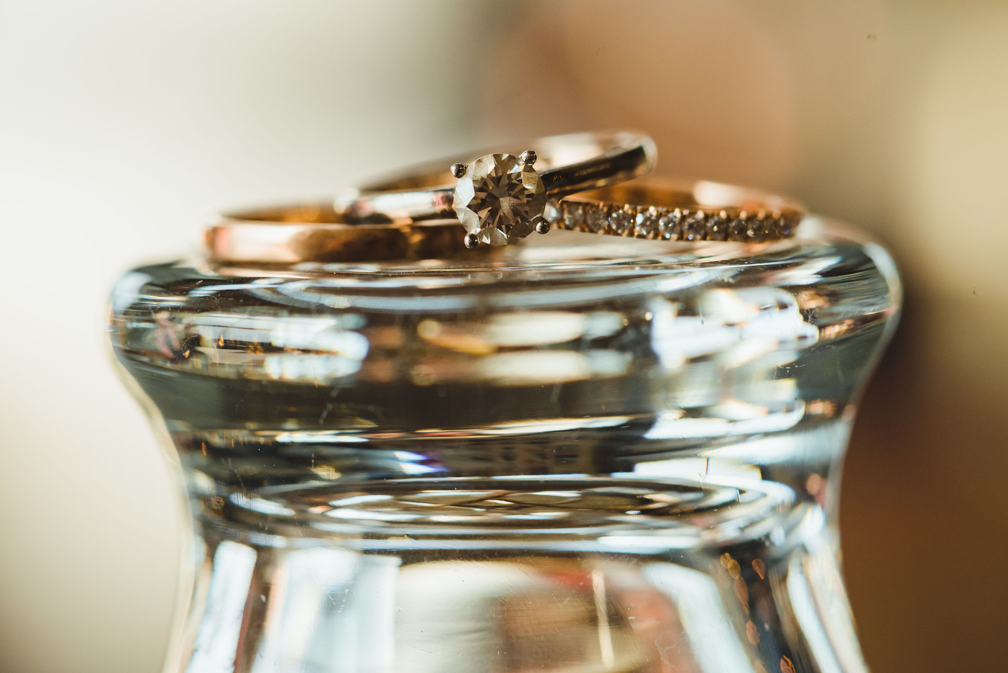 wedding bands resting on upside down pint glass Henderson Brewing Company wedding Toronto