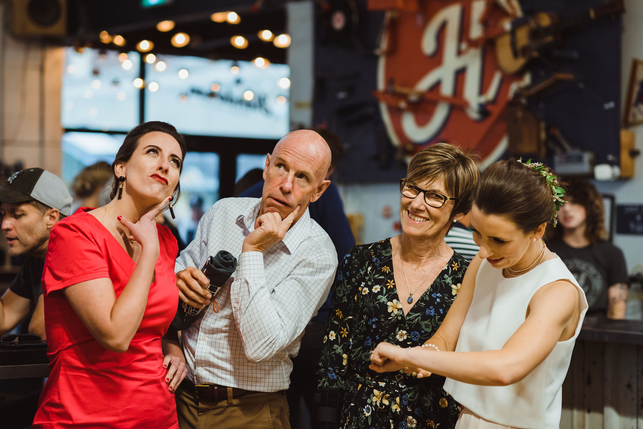 bride and her family all striking funny positions at Henderson's Brewing Company Toronto