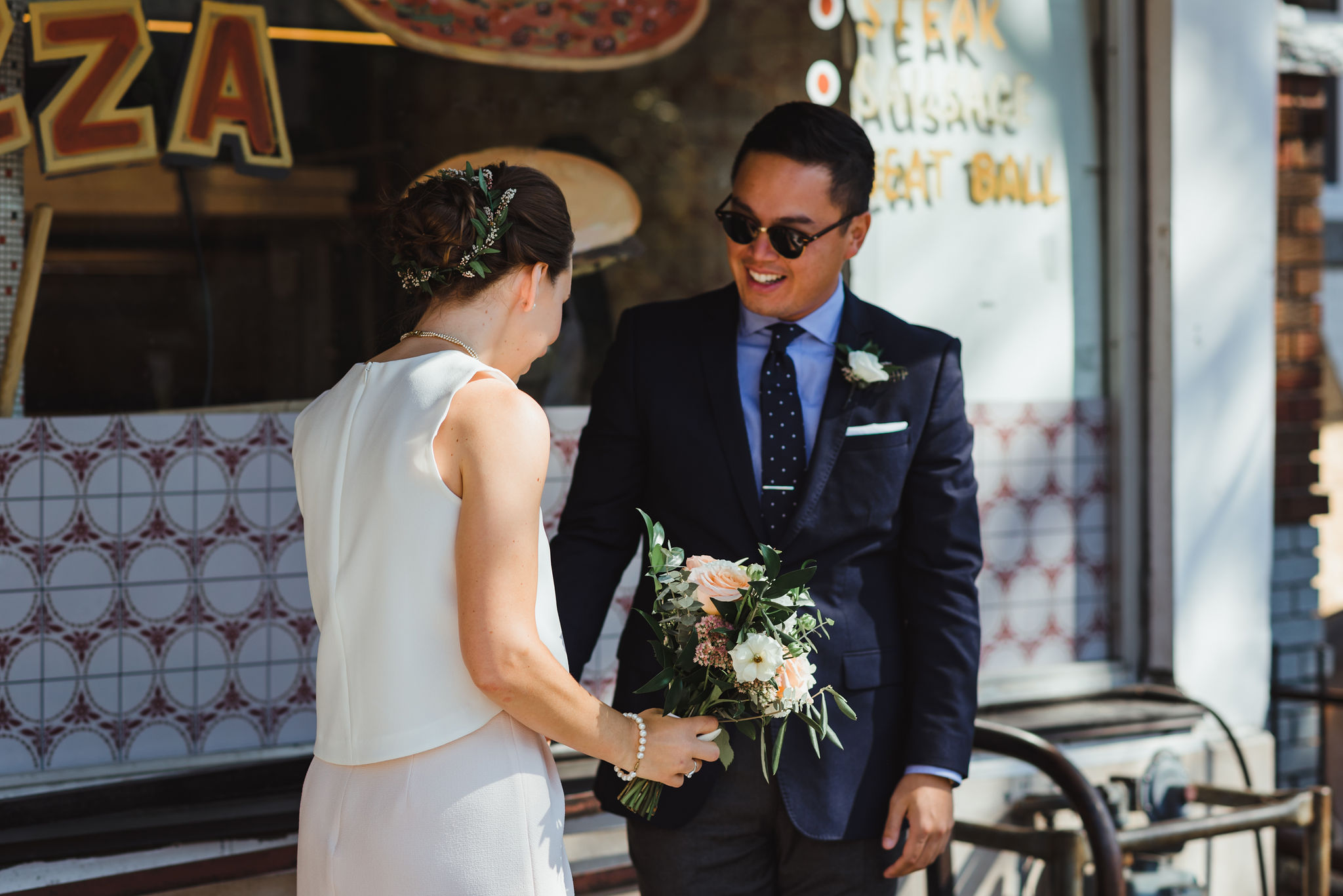 bride and grooms first look in front of Bitondo's Pizzeria Toronto Canada wedding photography