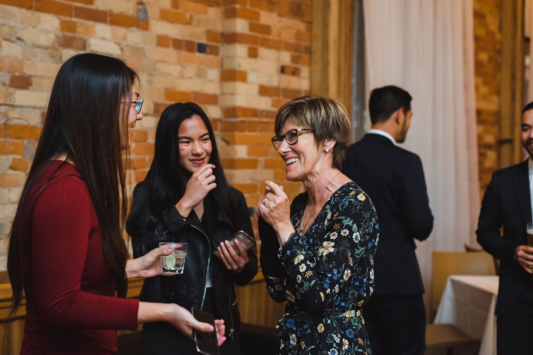 mother of the bride smiling and chatting with wedding guests during reception at the Gladstone Hotel Toronto 