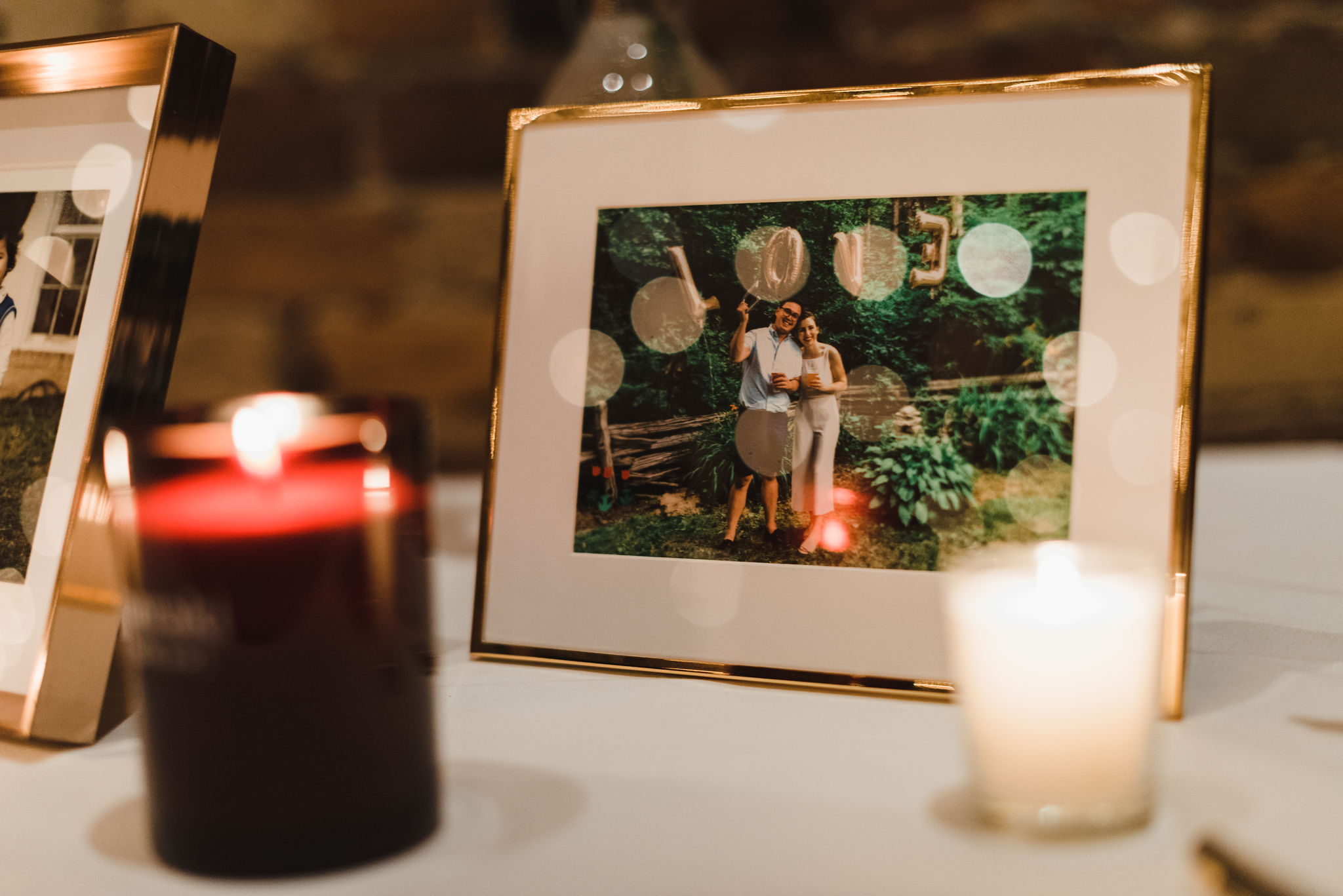 table with candles and picture frame with an old picture of the bride and groom Gladstone Hotel Toronto 