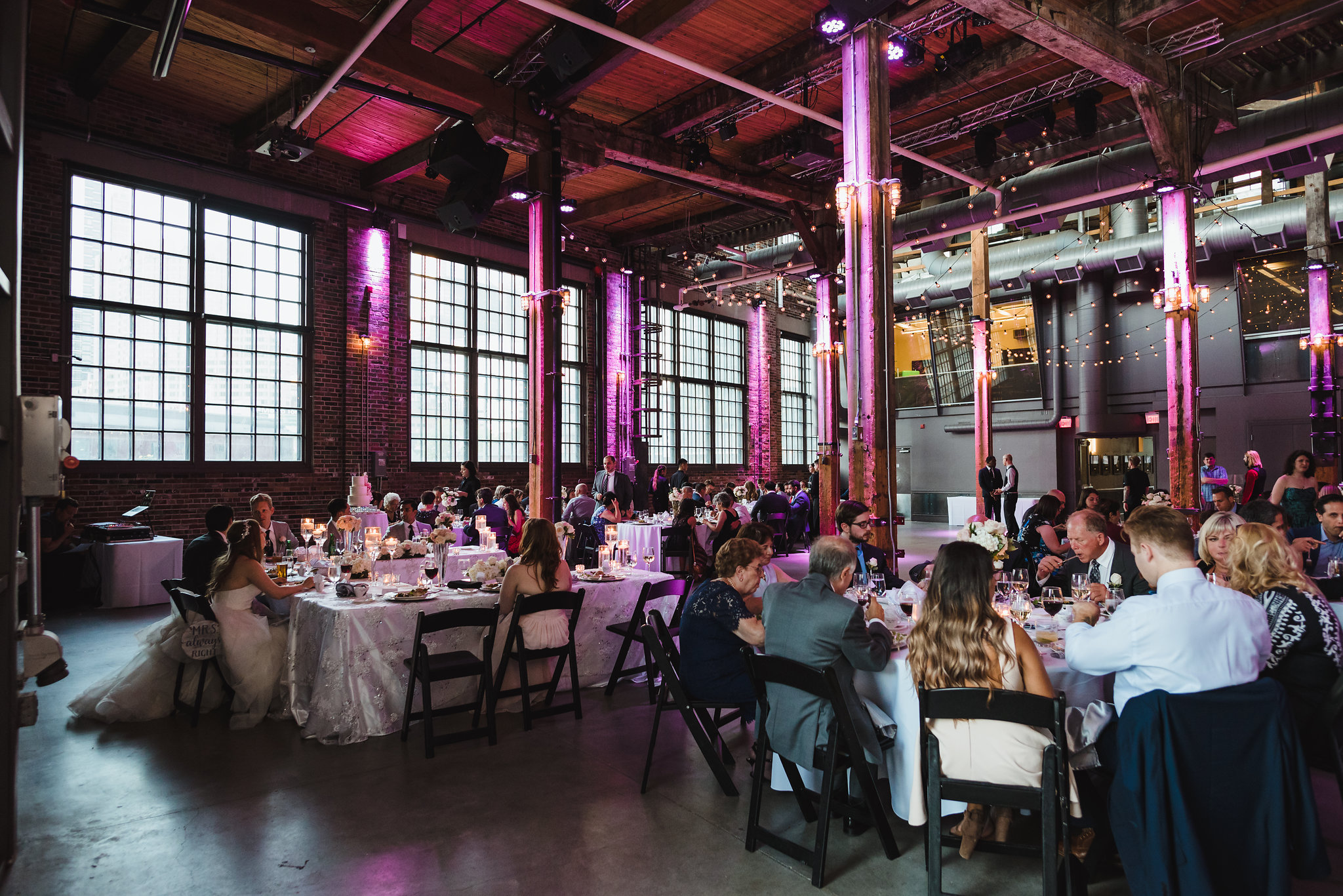 wedding guests seated during wedding reception at Steam Whistle Brewing
