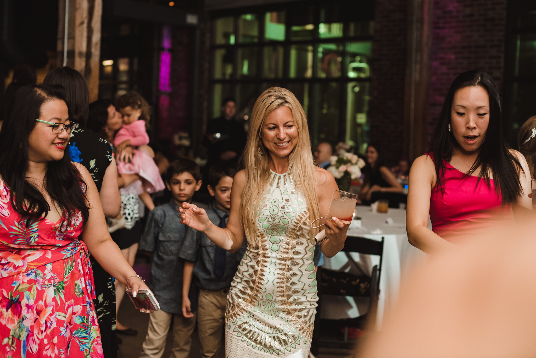 wedding guests dancing during wedding at Steam Whistle Brewing Toronto Canada wedding guests dancing during wedding at Steam Whistle Brewing Toronto Canada