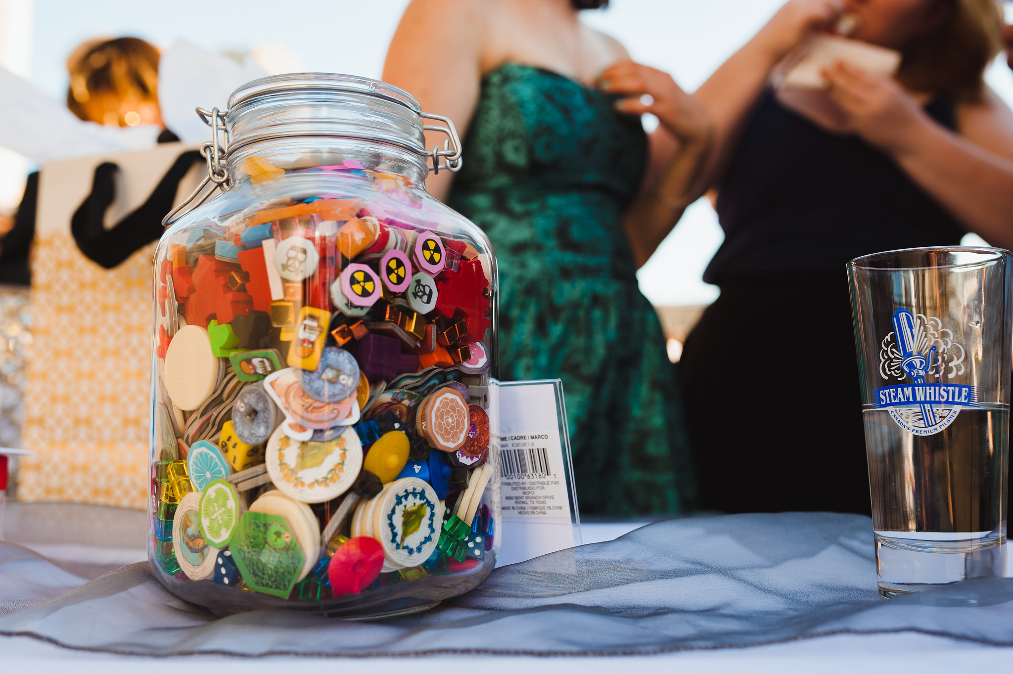 pint of Steam Whistle Pilsner beside jar of game pieces Toronto wedding photography