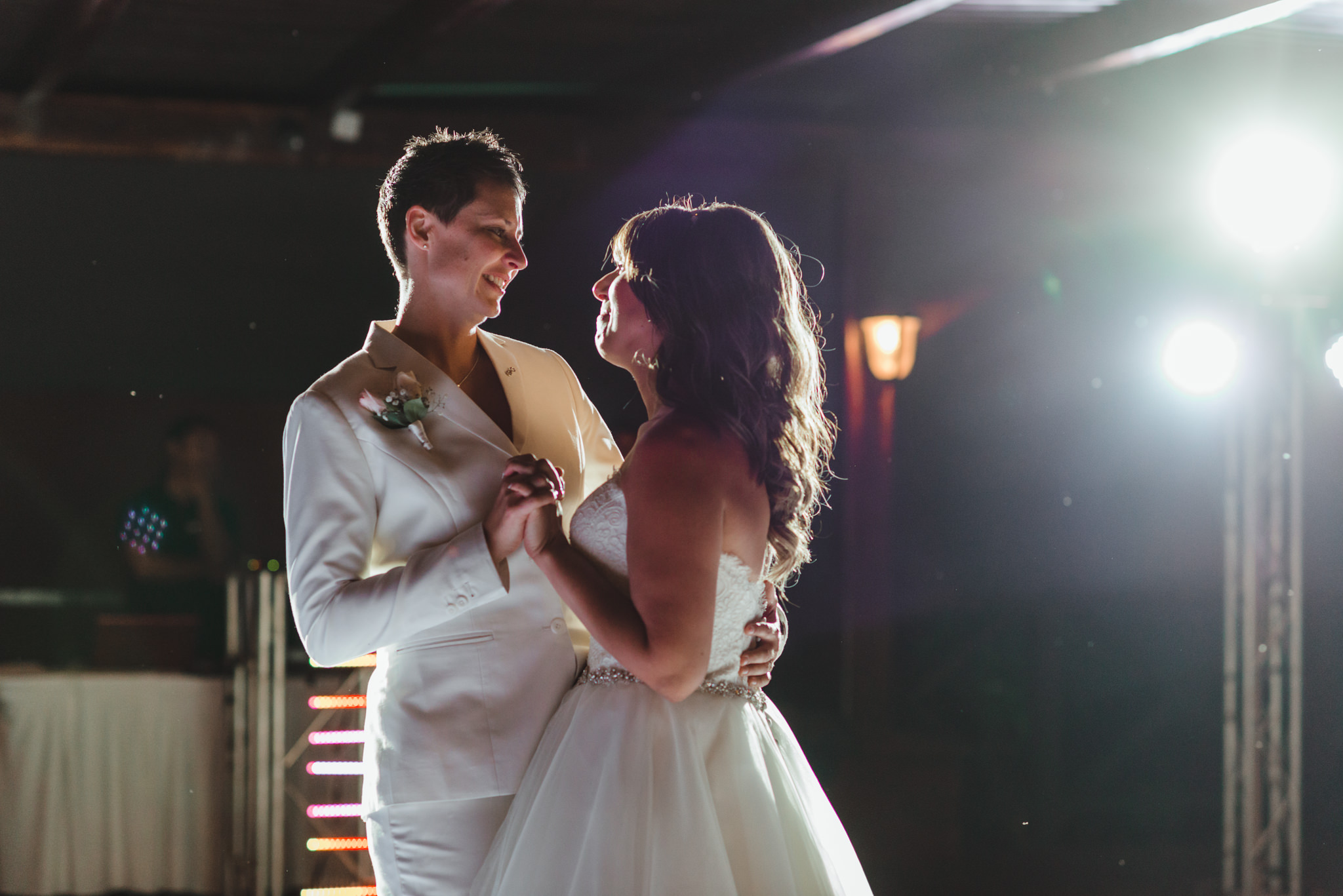 brides share their first dance during wedding reception at Now Sapphire Resort in Mexico