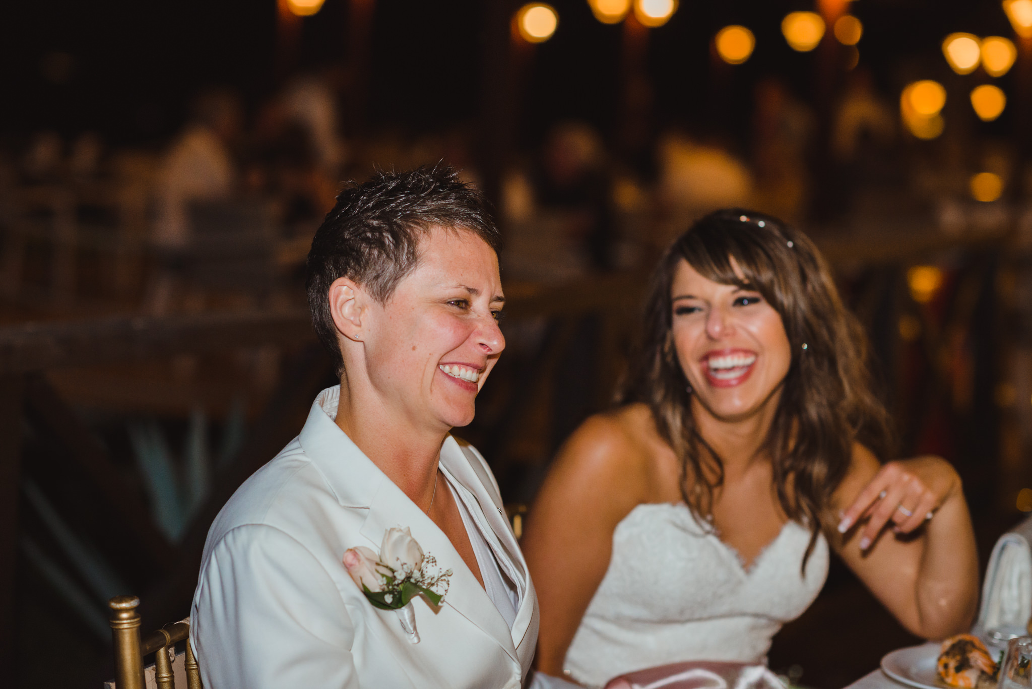 brides laughing during wedding reception at Now Sapphire Resort in Mexico