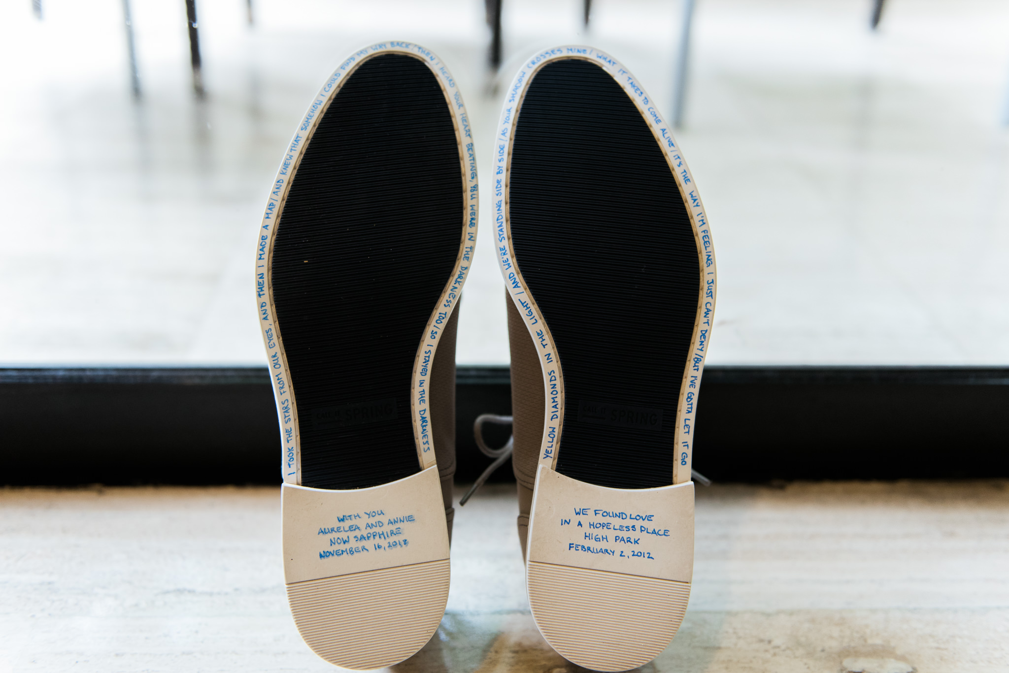 brides wedding shoes with blue writing on the bottom with personalized messages ahead of their destination wedding at Now Sapphire Resort in Mexico