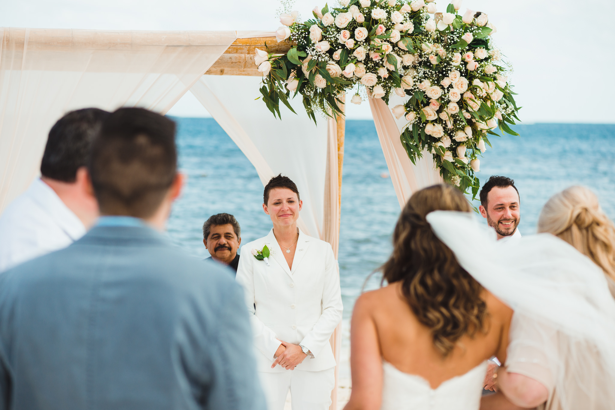 bride walking into wedding alter at a beach ceremony at Now Sapphire Resort in Mexico