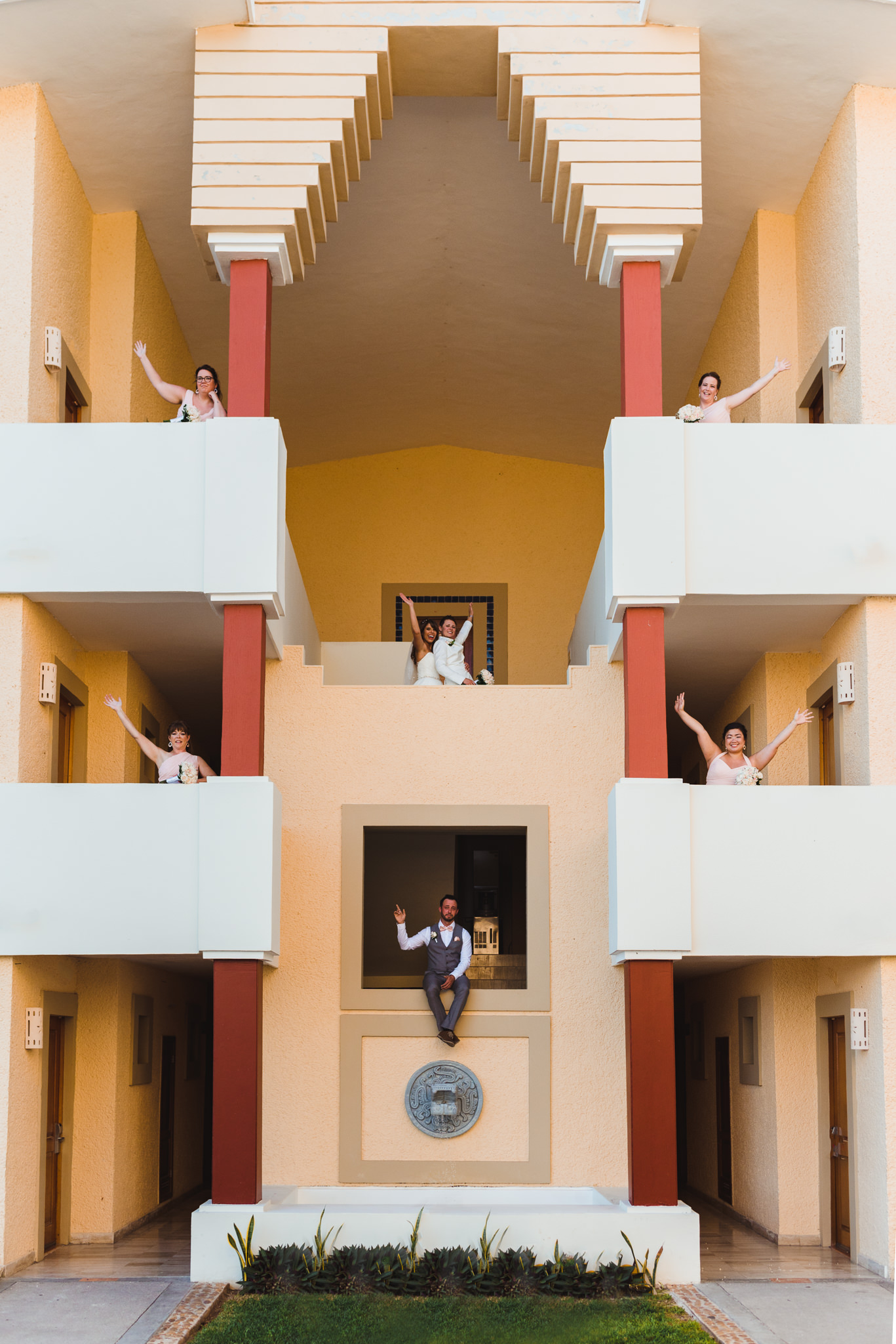brides and wedding party standing in different balconies of Now Sapphire Resort Mexico how to be really relaxed during your wedding