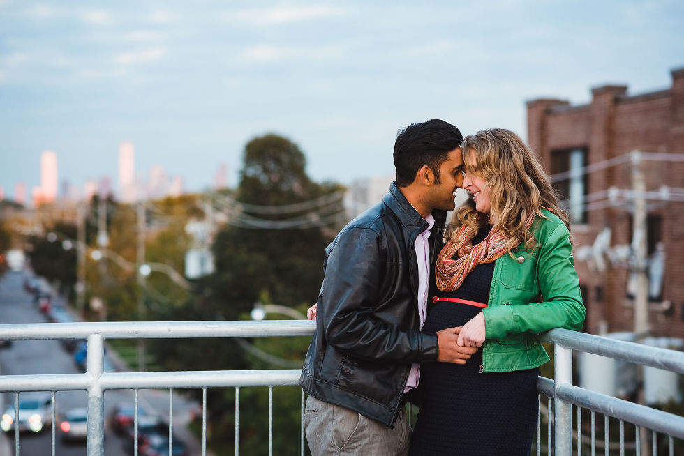 man and woman embracing each other for maternity shots in the Junction neighbourhood of Toronto