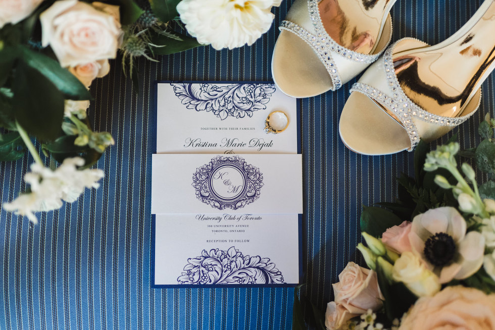 wedding card with wedding rings on it, surrounded by woman
