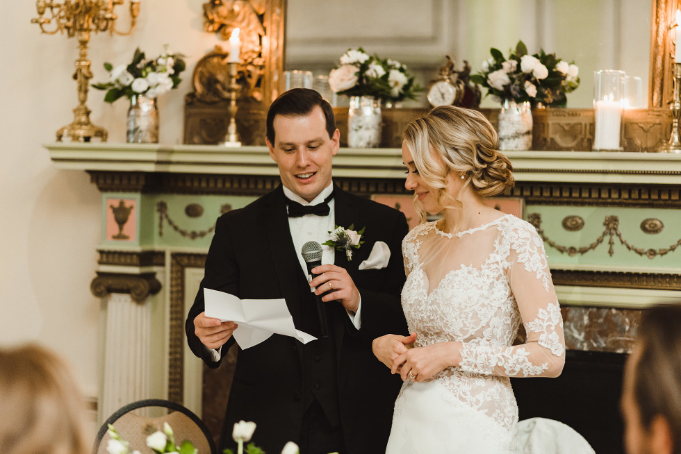 bride and groom reading wedding speech during reception at the iconic downtown venue of the University Club in Toronto