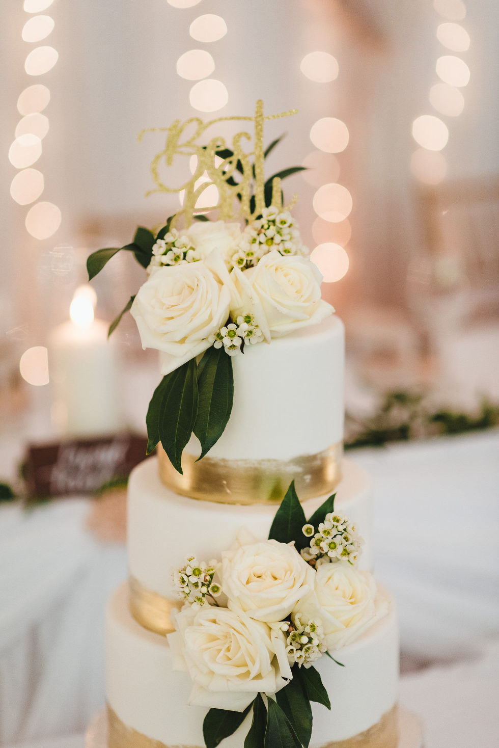 best day cake topper with white roses and white and gold cake at Fantasy Farms in Toronto Ontario