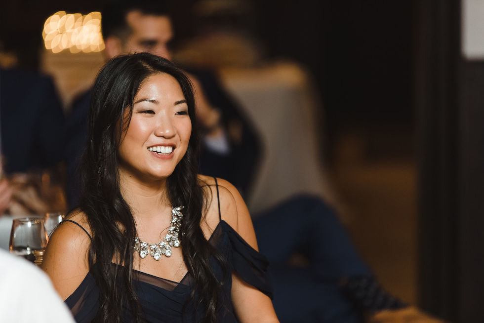girl wearing black dress with statement silver necklace at a wedding at Fantasy Farms in Toronto Ontario