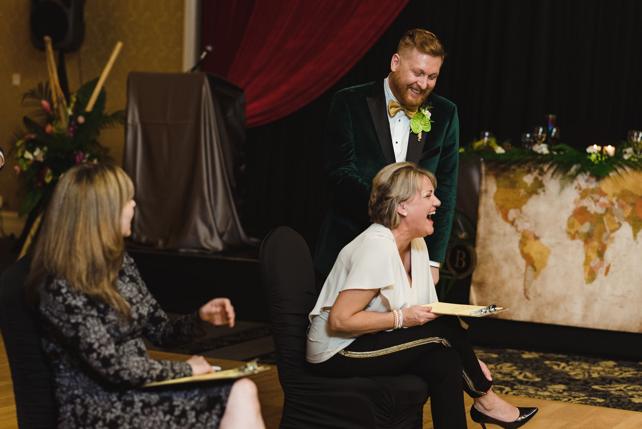 wedding guest and groom laughing during a fun wedding game for the reception at the Hilton Fallsview in Niagara Falls