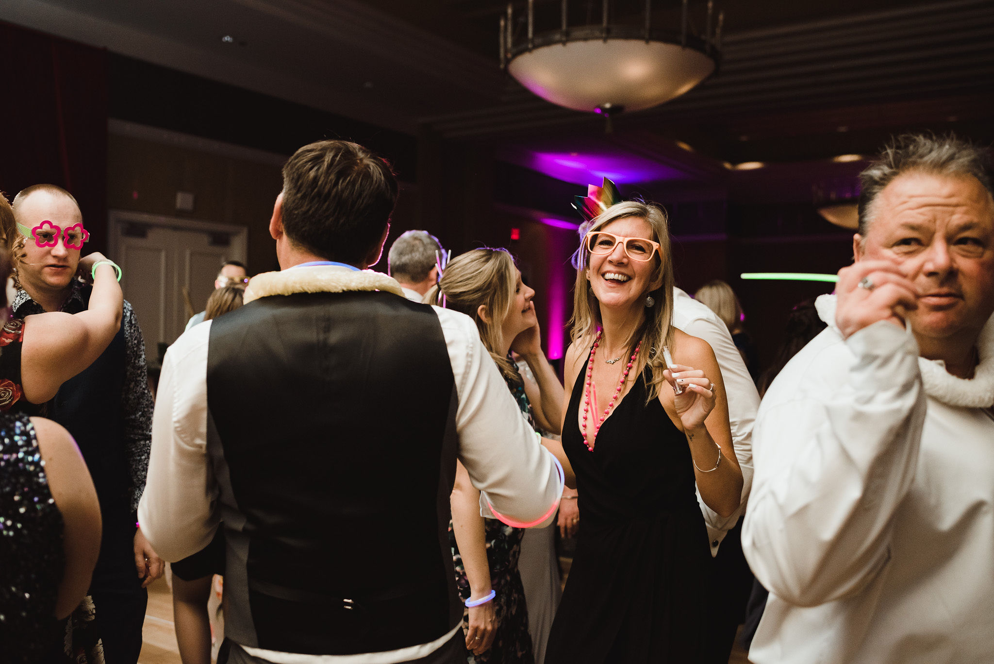 wedding guests dancing and laughing during a fun wedding at the Hilton Fallsview in Niagara Falls