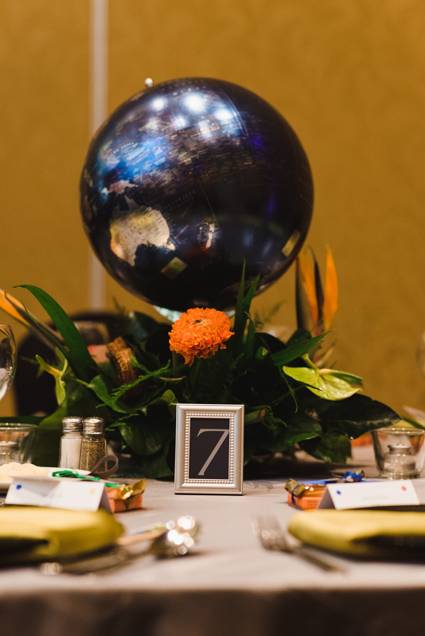 table setting with a globe centrepiece and the number 7 sign for a wedding at the Hilton Fallsview in Niagara Falls