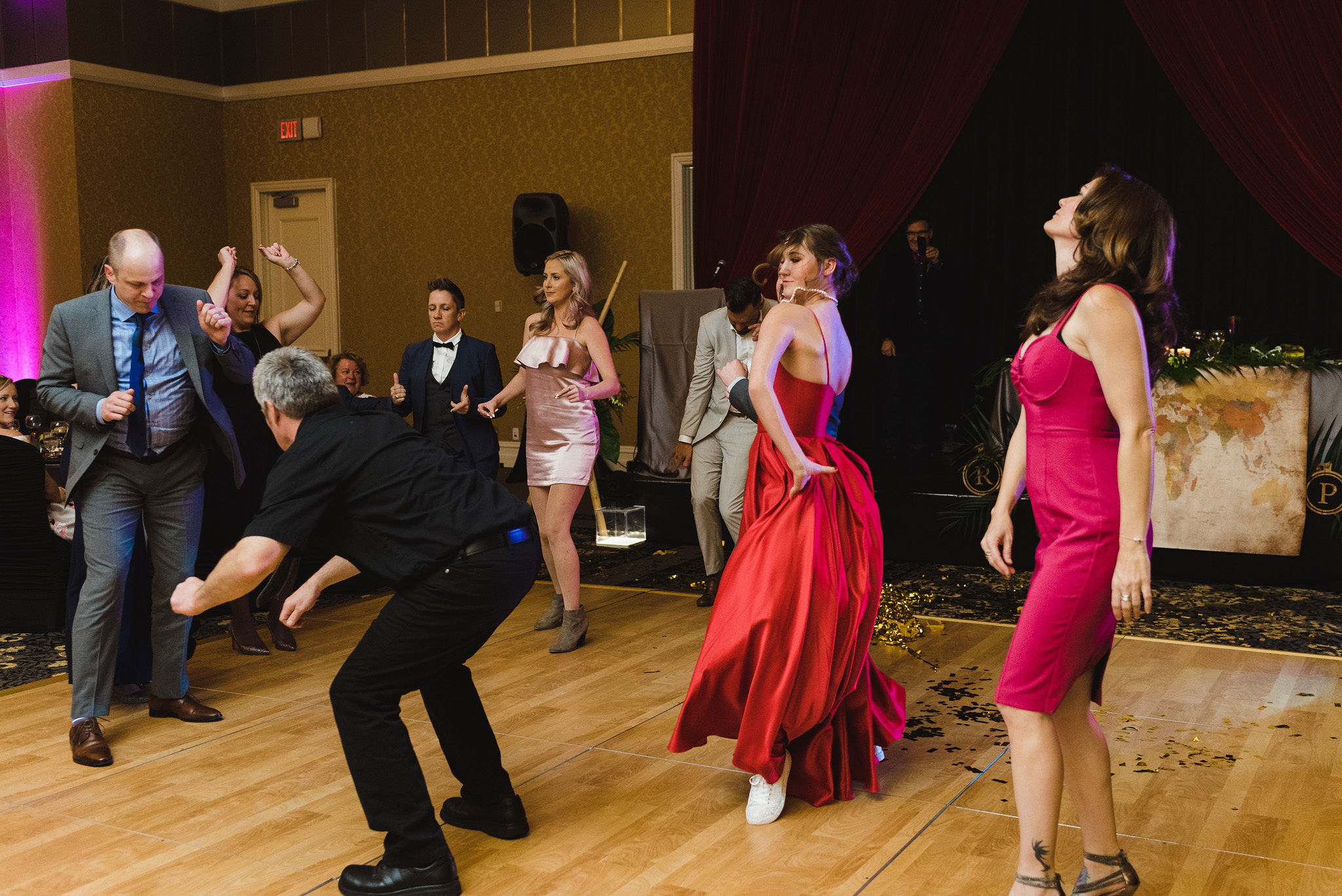 wedding guests dancing during a fun wedding reception at the Hilton Fallsview in Niagara Falls