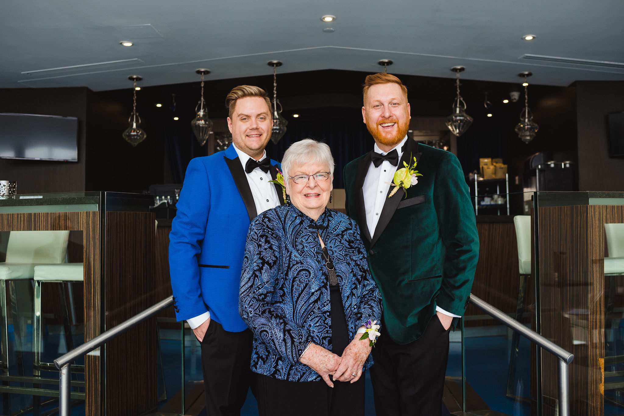 Grooms standing behind the grandmother before wedding ceremony at the Hilton hotel in Niagara Falls