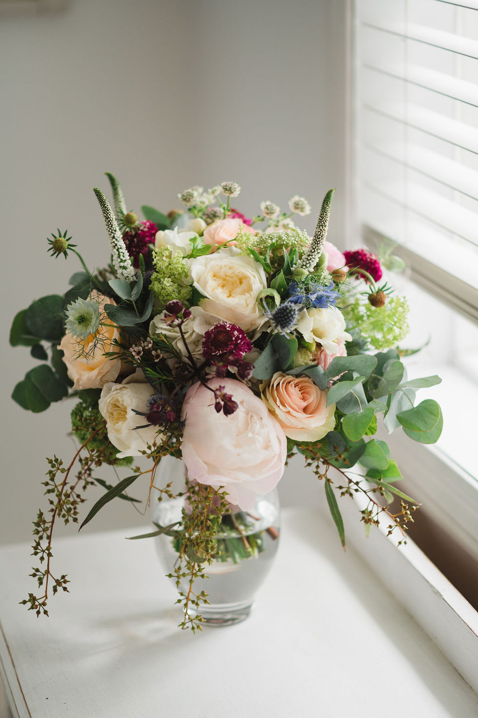 colourful floral bouquet in windowsill before a charming southern style wedding at Ruthven Park National Historic Site