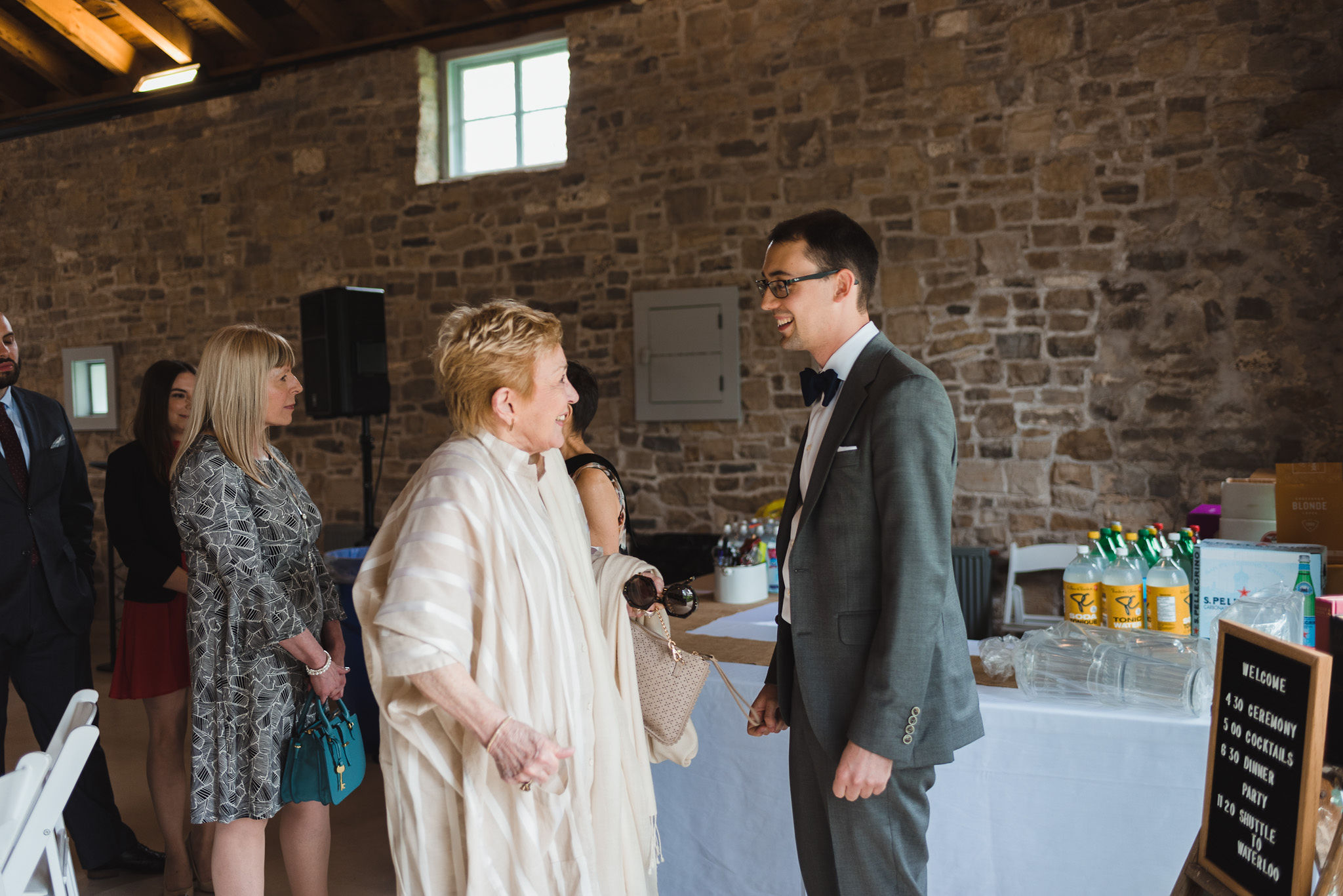 groom greeting guests before his charming southern style wedding at Ruthven Park National Historic Site