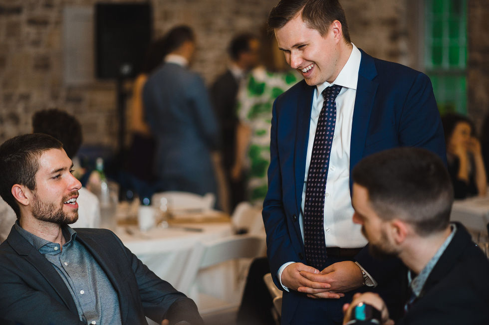 wedding guests laughing at their table during a charming southern style wedding at Ruthven National Historic Site near Hamilton