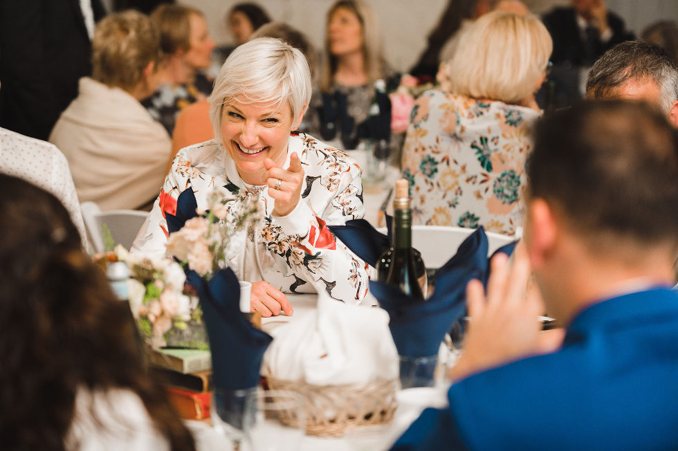 wedding guests laughing at their table during a charming southern style wedding at Ruthven National Historic Site near Hamilton