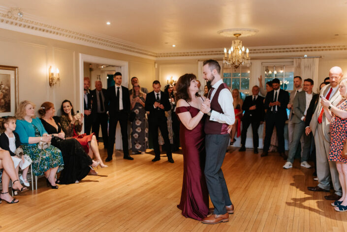 groom and family dancing