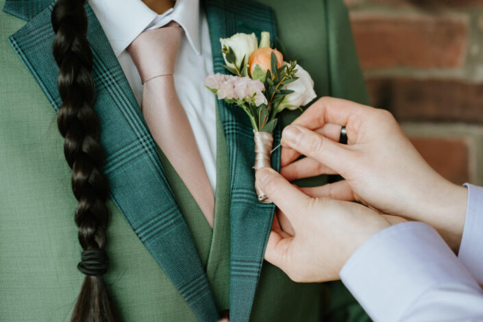 adjusting a boutonniere